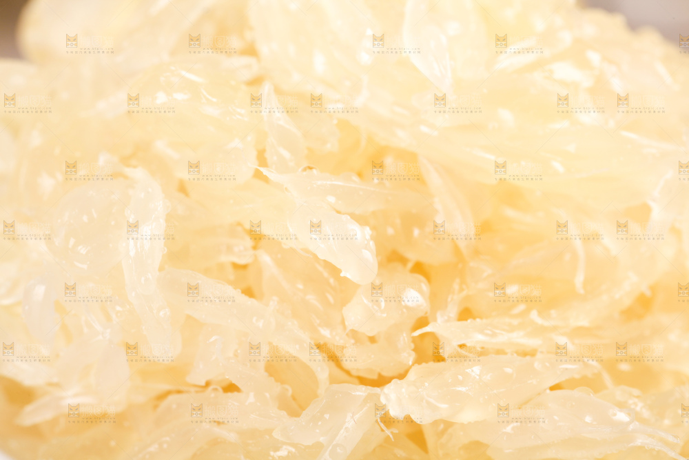 格子底上的白肉蜜柚