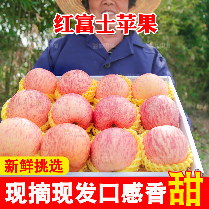 手里端着一箱条纹苹果