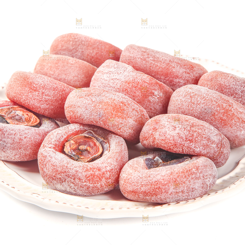 白底上放着一盘圆柿饼